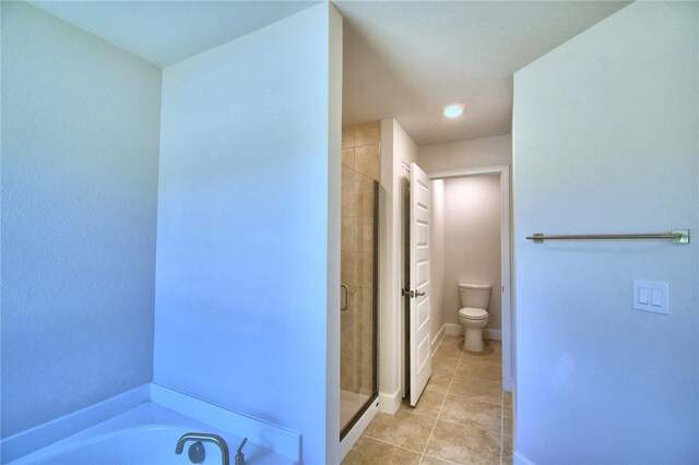 bathroom with independent shower and bath, tile patterned floors, and toilet