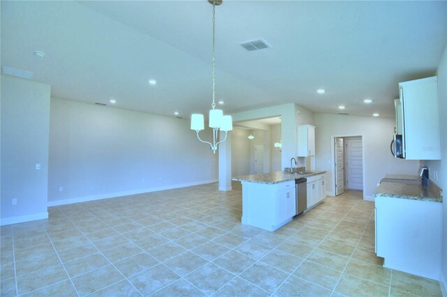 kitchen featuring light tile patterned flooring, white cabinets, and pendant lighting