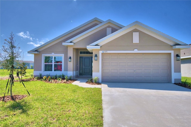 view of front of property featuring a garage and a front yard