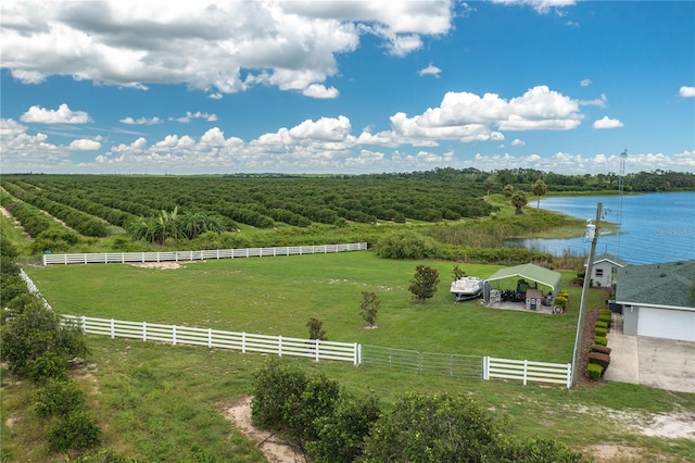 drone / aerial view featuring a rural view and a water view