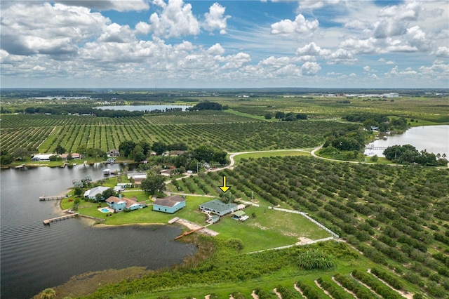 drone / aerial view with a rural view and a water view