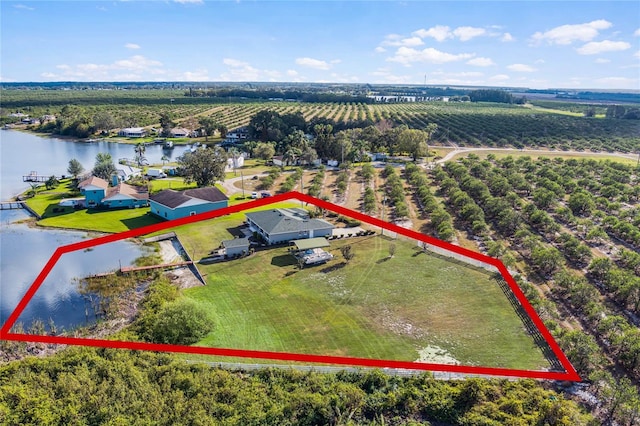 birds eye view of property with a rural view and a water view