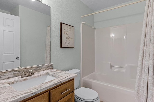 full bathroom featuring shower / bath combination with curtain, vanity, a textured ceiling, and toilet