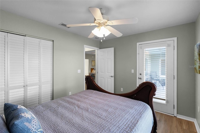 bedroom featuring wood-type flooring, a closet, and ceiling fan