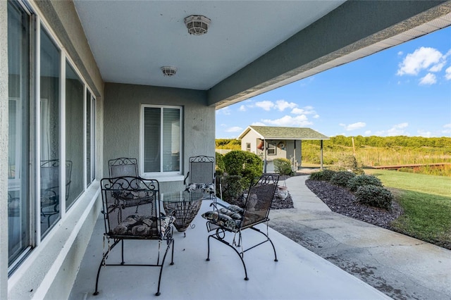 view of patio featuring an outbuilding