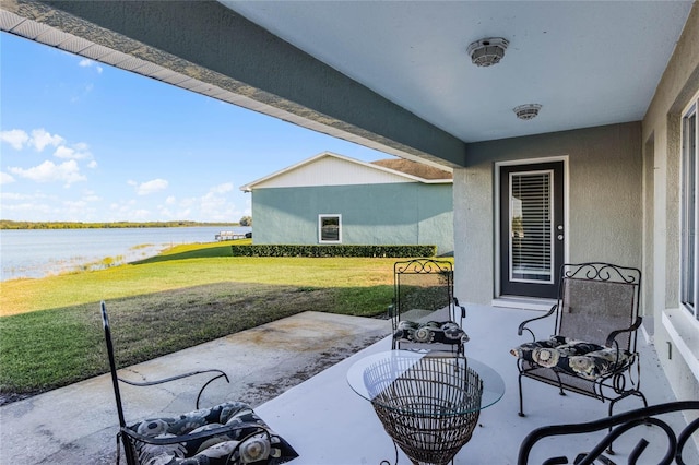 view of patio featuring a water view