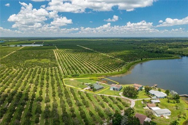 birds eye view of property with a water view and a rural view