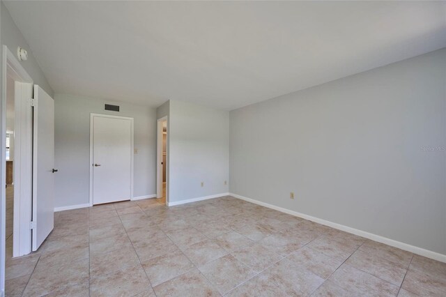 unfurnished bedroom with light tile patterned floors