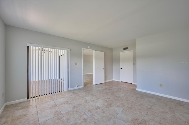 view of tiled spare room