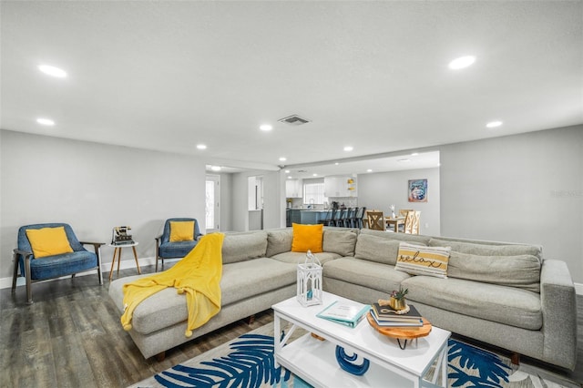 living room with dark hardwood / wood-style flooring