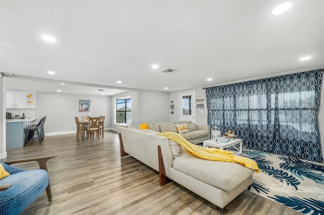 living room with light hardwood / wood-style flooring