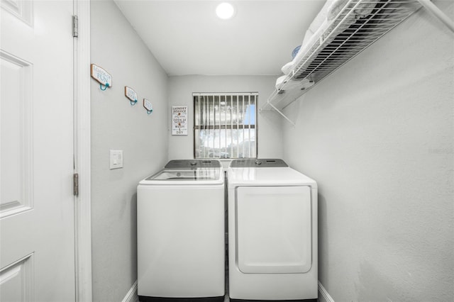 washroom with separate washer and dryer