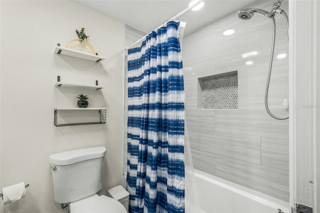 bathroom featuring toilet and shower / tub combo