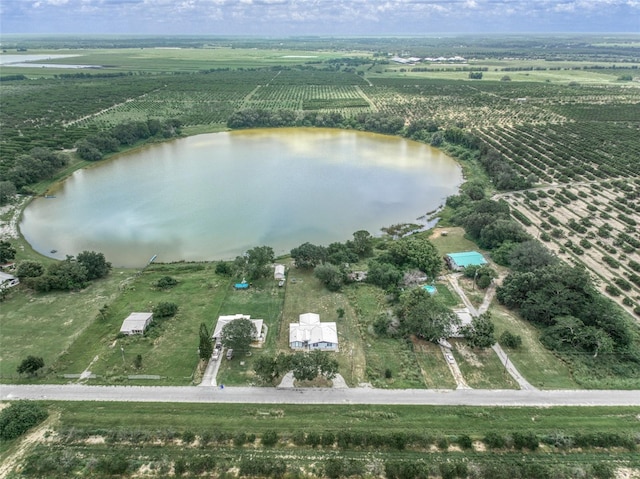 drone / aerial view featuring a rural view and a water view