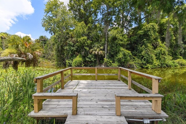 wooden deck featuring a water view