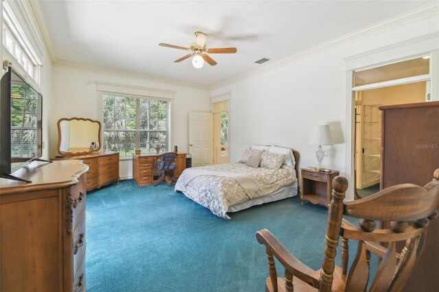 bedroom featuring crown molding, carpet, and ceiling fan