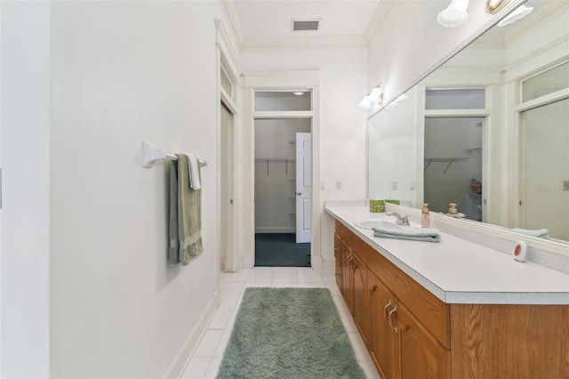 bathroom with vanity, tile patterned flooring, and ornamental molding