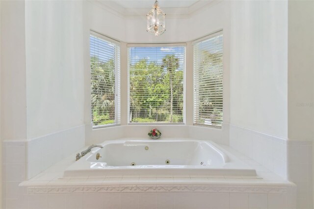 bathroom with a healthy amount of sunlight and crown molding