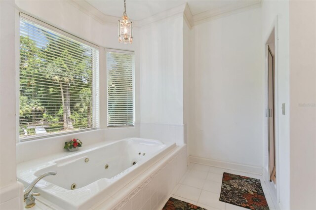 bathroom featuring a relaxing tiled tub, tile patterned flooring, and ornamental molding