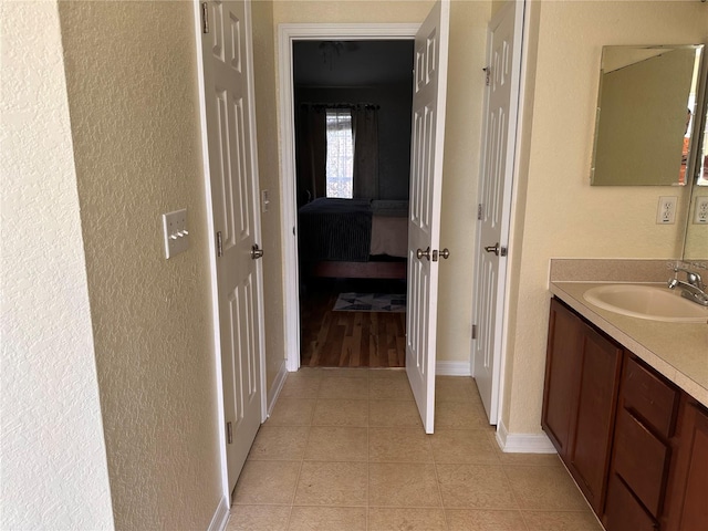 bathroom featuring hardwood / wood-style flooring and vanity