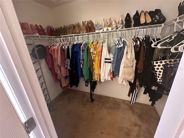 walk in closet featuring carpet floors