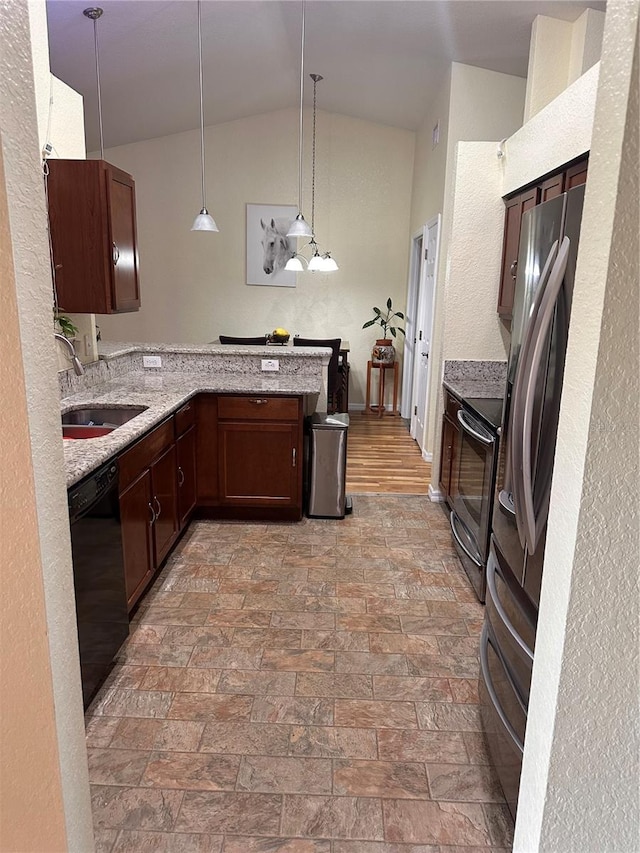 kitchen featuring kitchen peninsula, range with electric stovetop, light hardwood / wood-style floors, pendant lighting, and sink