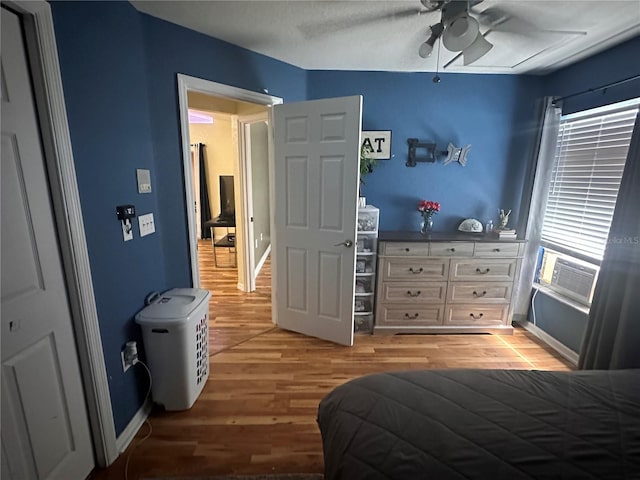 bedroom featuring wood-type flooring and ceiling fan