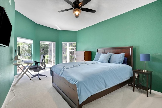 bedroom featuring ceiling fan and light carpet