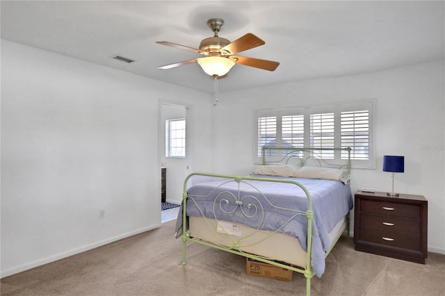 bedroom featuring ceiling fan and light colored carpet