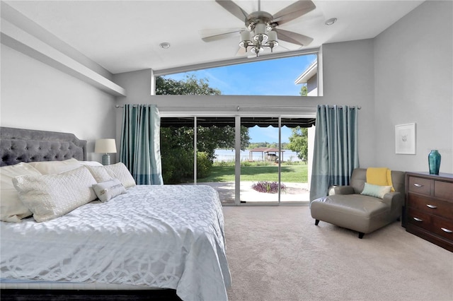 carpeted bedroom with ceiling fan, access to outside, and lofted ceiling