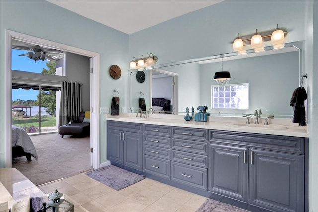 bathroom featuring ceiling fan, tile patterned floors, and vanity