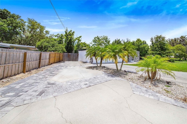 view of patio featuring fence