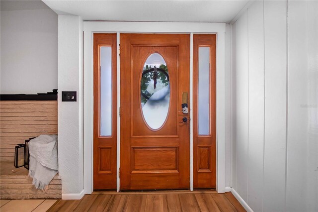 foyer with wood-type flooring