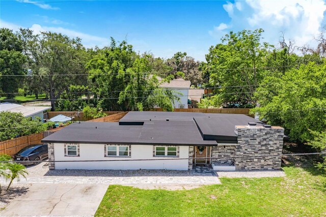 back of house with a yard and a patio area