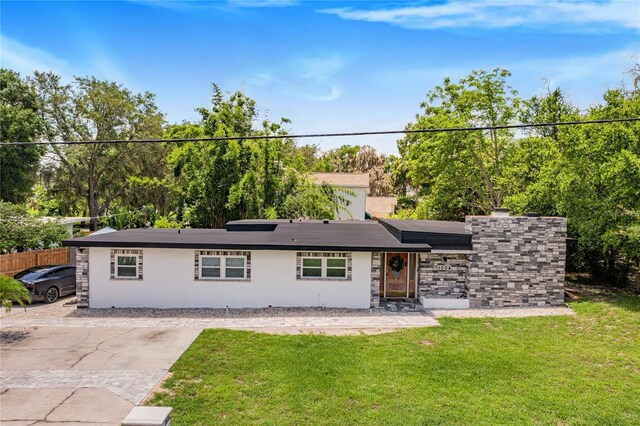 view of front of home with a front lawn