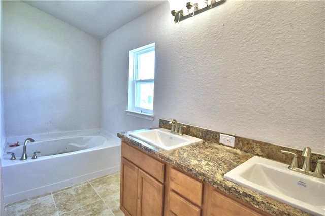 bathroom with a tub to relax in and vanity