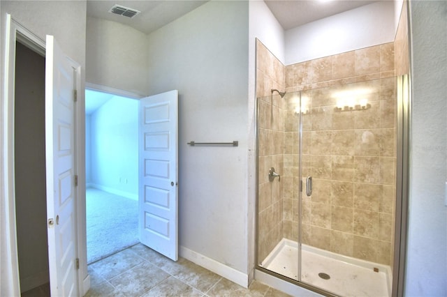 bathroom featuring tile patterned floors and an enclosed shower