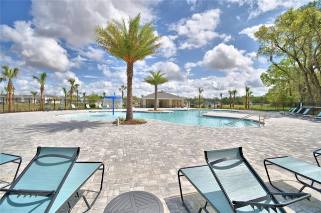 view of swimming pool featuring a patio area and pool water feature