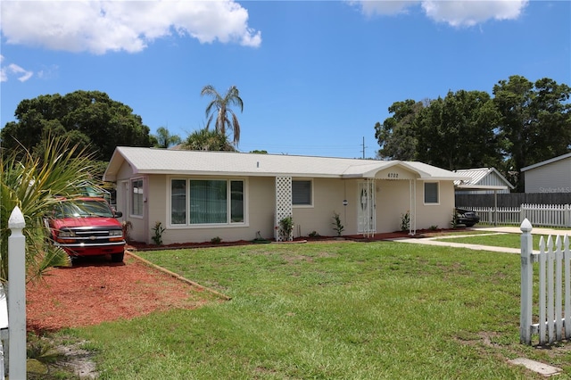 ranch-style home with a front yard