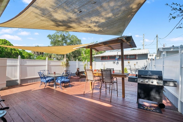 wooden terrace featuring area for grilling