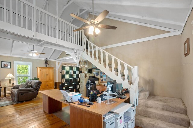 interior space featuring beamed ceiling, high vaulted ceiling, ceiling fan, and hardwood / wood-style flooring