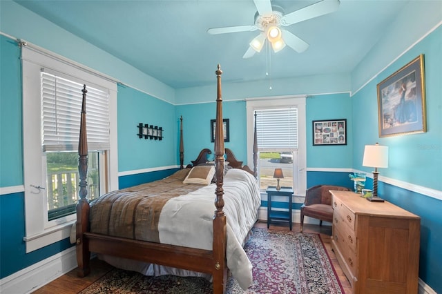 bedroom with wood-type flooring and ceiling fan