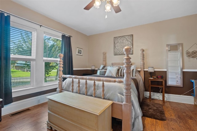 bedroom with hardwood / wood-style floors and ceiling fan