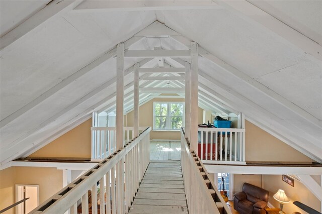 bonus room with vaulted ceiling and hardwood / wood-style floors