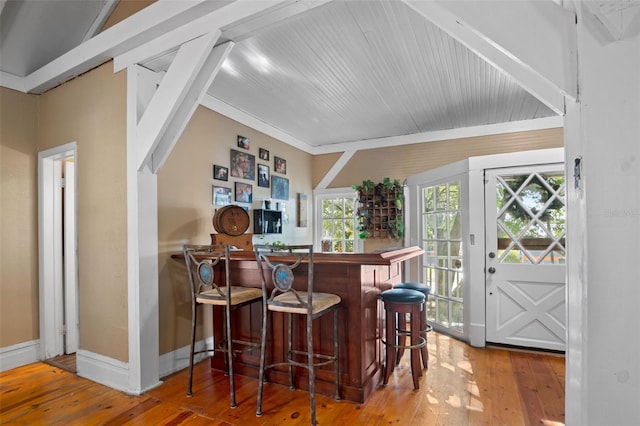 bar featuring hardwood / wood-style flooring