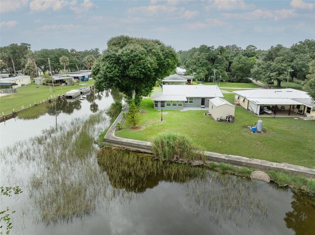 birds eye view of property with a water view