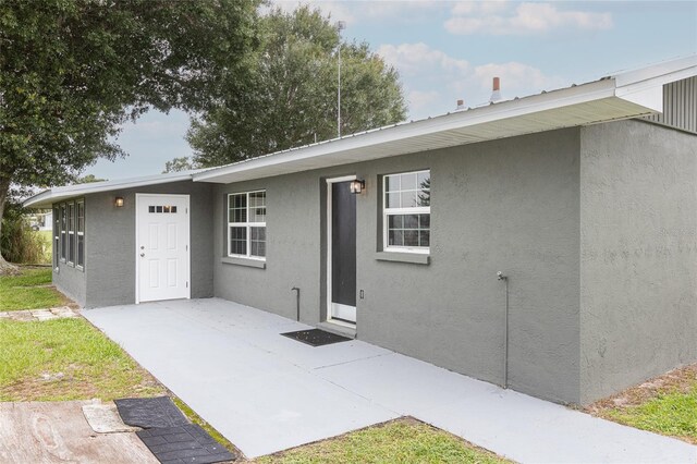 back of house with a patio area