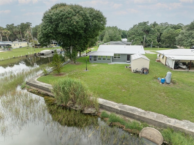 birds eye view of property with a water view