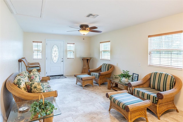 sitting room featuring ceiling fan and a healthy amount of sunlight