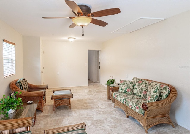 sitting room featuring ceiling fan